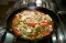 Kaninchengeschnetzeltes „B�rlauch“ mit Tomate und Ruccola